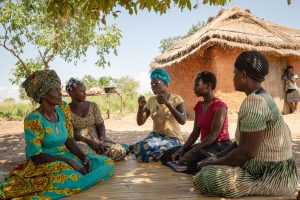 Members of Ngwedo United Women’s Group in Buliisa, Uganda. The group has helped bridge the information gap between women, they have gained a bigger voice in their community, started kitchen gardens and also have a savings plan. Photo by Esther Ruth Mbabazi.