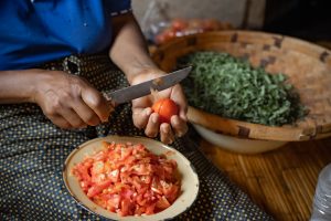 A woman prepares a meal in rural Zimbabwe